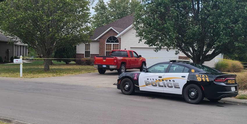 A police car was parked outside of 1309 Cedar Crest Dr. on Tuesday, and the house, along with a pickup truck parked in the driveway, was roped off with police tape.