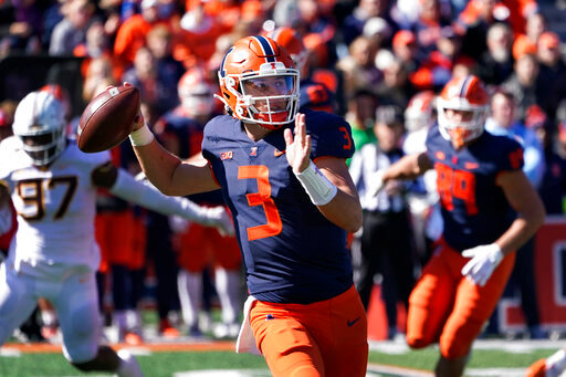 Illinois quarterback Tommy DeVito throws a pass during the second half of an NCAA college football game against Minnesota, Saturday, Oct. 15, 2022, in Champaign, Ill. (AP Photo/Charles Rex Arbogast)