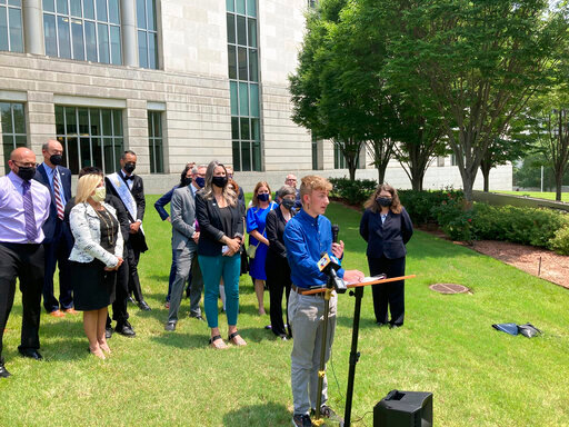 FILE - Dylan Brandt speaks at a news conference outside the federal courthouse in Little Rock, Ark., July 21, 2021. Brandt, a teenager, is among several transgender youth and families who are plaintiffs challenging a state law banning gender confirming care for trans minors. The nation&rsquo;s first trial over a state&rsquo;s ban on gender-confirming care for children begins in Arkansas on Monday, Oct. 17, 2022, the latest fight over restrictions on transgender youth championed by Republican leaders and widely condemned by medical experts. (AP Photo/Andrew DeMillo, File)