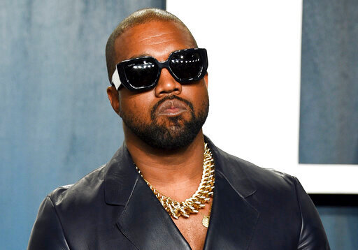 FILE - Kanye West arrives at the Vanity Fair Oscar Party on Feb. 9, 2020, in Beverly Hills, Calif. The rapper formerly known as Kanye West is offering to buy right-wing friendly social network Parler after being booted off of Twitter and Instagram. (Photo by Evan Agostini/Invision/AP, File)