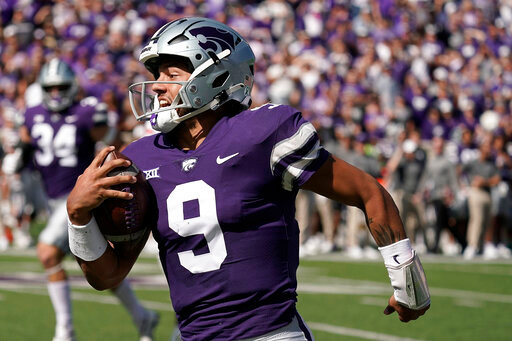 FILE - Kansas State quarterback Adrian Martinez runs the ball during the first half of an NCAA college football game against Texas Tech Saturday, Oct. 1, 2022, in Manhattan, Kan. Martinez was selected top first-year transfer in the Associated Press Big 12 Midseason Awards, Tuesday, Oct. 11, 2022. (AP Photo/Charlie Riedel, File)