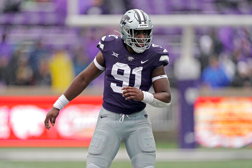 FILE - Kansas State defensive end Felix Anudike-Uzomah gets into position during the first half of an NCAA college football game against Missouri Saturday, Sept. 10, 2022, in Manhattan, Kan. Anudike-Uzomah was selected top defensive player in the Associated Press Big 12 Midseason Awards, Tuesday, Oct. 11, 2022. (AP Photo/Charlie Riedel, File)