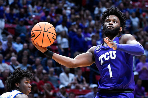 FILE - TCU guard Mike Miles Jr. drives to the basket during the first half of the team's first-round NCAA college basketball tournament game against Seton Hall on March 18, 2022, in San Diego.  (AP Photo/Denis Poroy, File)