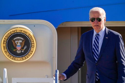 President Joe Biden pauses at the top of the stairs as he boards Air Force One at Andrews Air Force Base, Md., Thursday, Oct. 20, 2022, en route to Pennsylvania. (AP Photo/Carolyn Kaster)