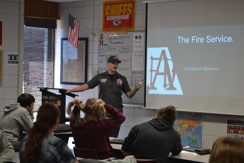 Arma Fire Lieutenant Clayton Bammer gives NEHS students a look into the life of a firefighter during Adam Smith&rsquo;s Intro to Law Enforcement and Public Safety class on Thursday.&nbsp;
