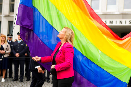 FILE - German interior Minister Nancy Faeser raises the rainbow flag for the first time at the German Interior Ministry in Berlin, Germany, on May 17, 2022. Qatar has summoned the German ambassador over remarks by Germany&rsquo;s interior minister, who appeared to criticize the decision to award the World Cup to the Gulf Arab nation because of its human rights record. (AP Photo/Markus Schreiber, File)