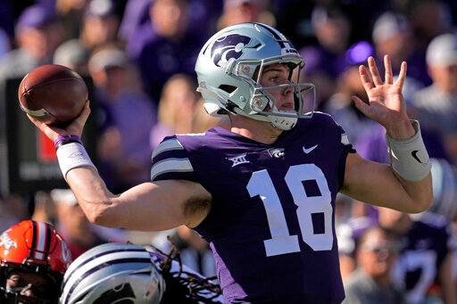Kansas State quarterback Will Howard throws during the first half of an NCAA college football game against Oklahoma State Saturday, Oct. 29, 2022, in Manhattan, Kan. (AP Photo/Charlie Riedel)
