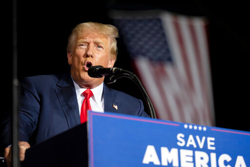 FILE - Former President Donald Trump speaks at a rally at the Minden Tahoe Airport in Minden, Nev., Saturday, Oct. 8, 2022.  For years, as Trump was soaring from reality TV star to the White House, his real estate empire was bankrolling big perks for some of his most trusted senior executives, including apartments and luxury cars.  Now Trump's company, the Trump Organization, is on trial this week for criminal tax fraud &mdash; on the hook for what prosecutors say was a 15-year scheme by top officials to hide the plums and avoid paying taxes.  (AP Photo/Jos&eacute; Luis Villegas, File)