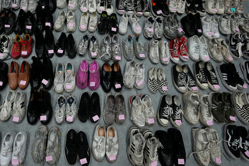 Shoes are seen among a huge collection items found in Itaewon following South Korea&rsquo;s deadliest crowd surge, at a temporary lost and found center at a gym in Seoul, South Korea, Tuesday, Nov. 1, 2022. Police have assembled the crumpled tennis shoes, loafers and Chuck Taylors, part of 1.5 tons of personal objects left by victims and survivors of the tragedy, in hopes that the owners, or their friends and family, will retrieve them. (AP Photo/Lee Jin-man)