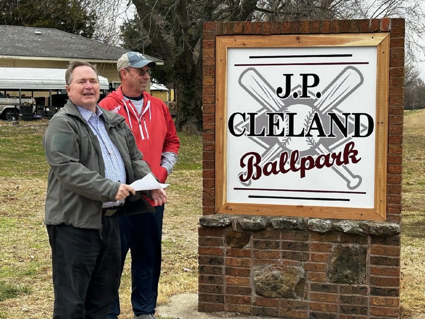 Arma City Council President Rob Lessen, left, commends J. P. Cleland for his efforts to enhance the ball park at the city&rsquo;s renaming ceremony on Friday.