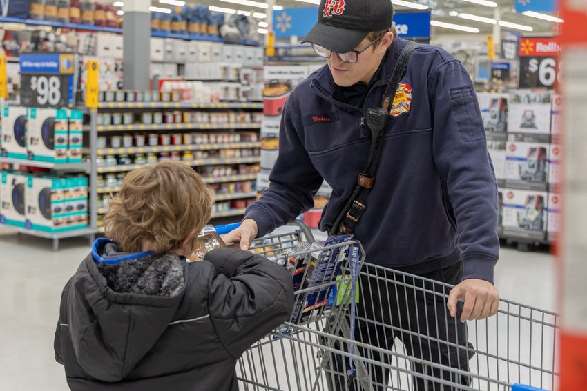 Eight students from Meadowlark Elementary School got to go Christmas shopping with Pittsburg firefighters this week. Firefighters met the students at Walmart to fill their carts with everything on their lists. This annual event is made possible through the Pittsburg Fire Department charity fund to which the firefighters contribute.