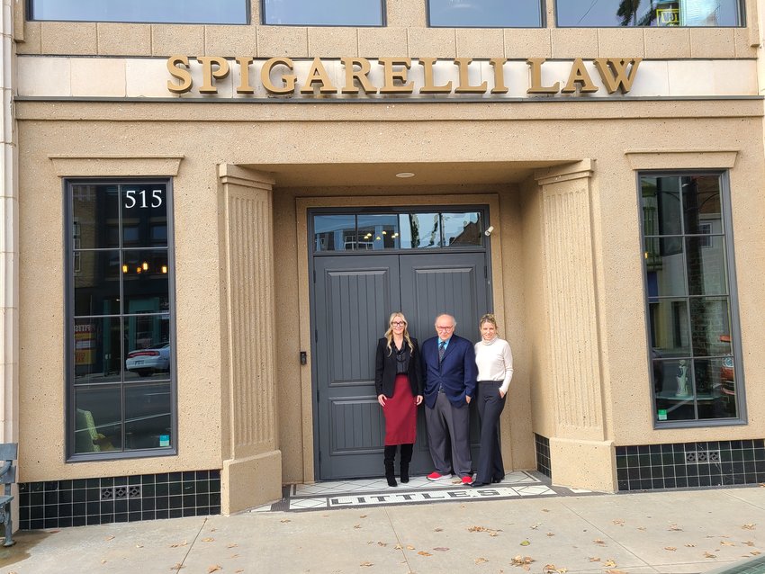 From left, the Spigarellis &mdash; Kala, Fred, and Angela &mdash; are shown here in front of their office on Broadway, which they moved into in 2015.