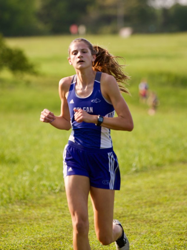 St. Mary&rsquo;s Colgan senior Lily Brown powers through the halfway point at the 2021 Girard Invitational held at Greenbush.