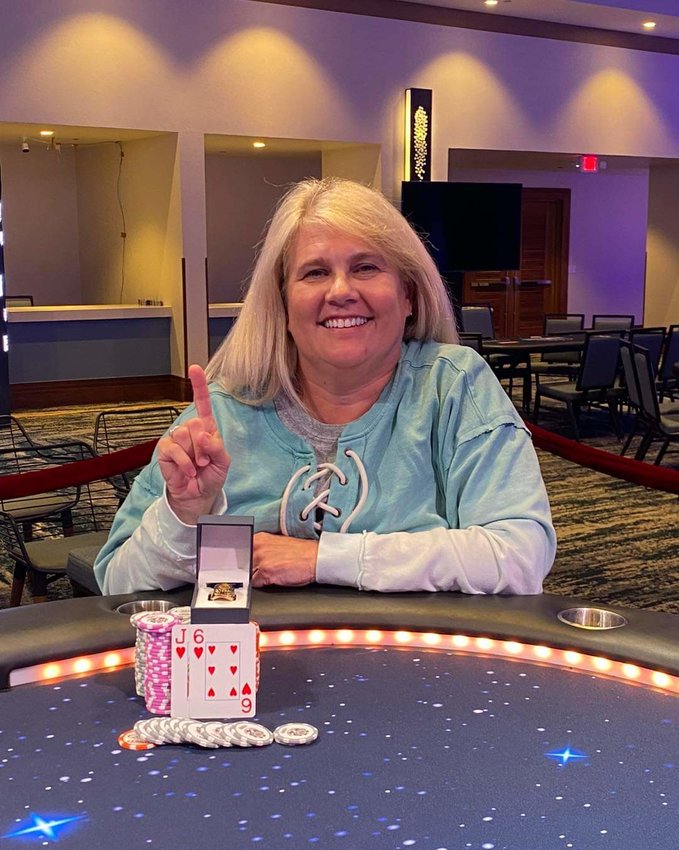 Therapist and personal coach Sandra Main shows off her ring and winnings after she won the World Series of Poker tournament in Aruba last month.