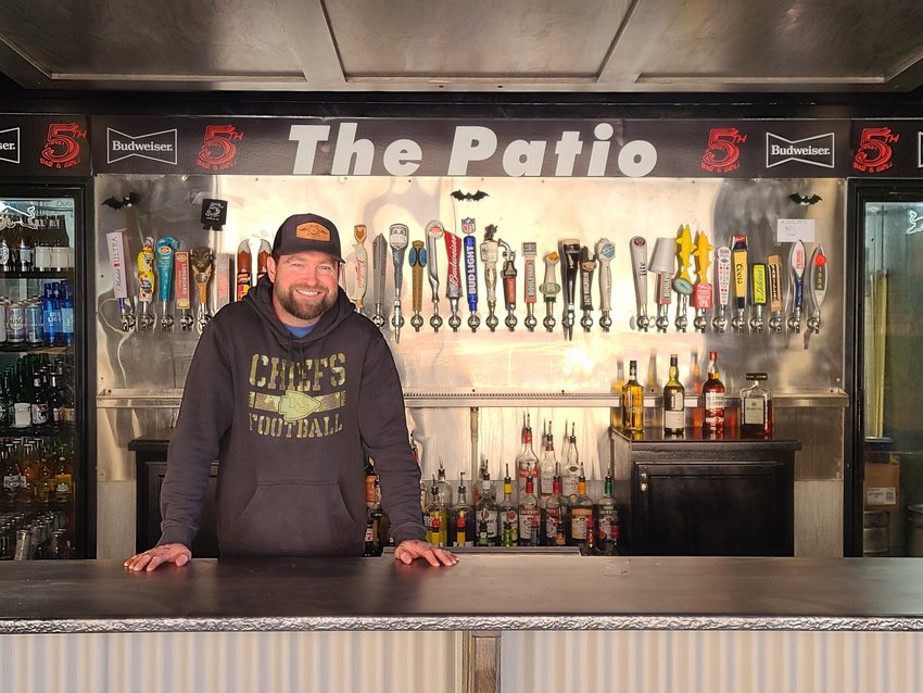 Co-owner Kyle Mullen stands in the newly built bar area of the outdoor patio at 5th Street Bar and Grill.