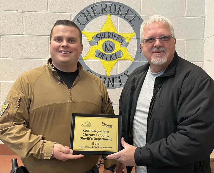 Cherokee County Chief Deputy Nate Jones, left, receives the 2022 Community Traffic Safety Award from KDOT Liaison Dan Kiser.