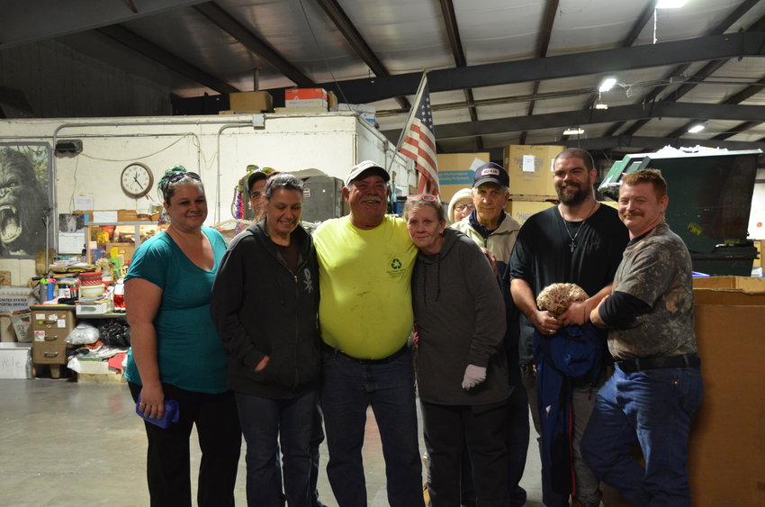 SEK Recycling Center Operations Manager Jerry Babcock, fourth from left, stands with the staff at his retirement party at the recycling center on Friday.