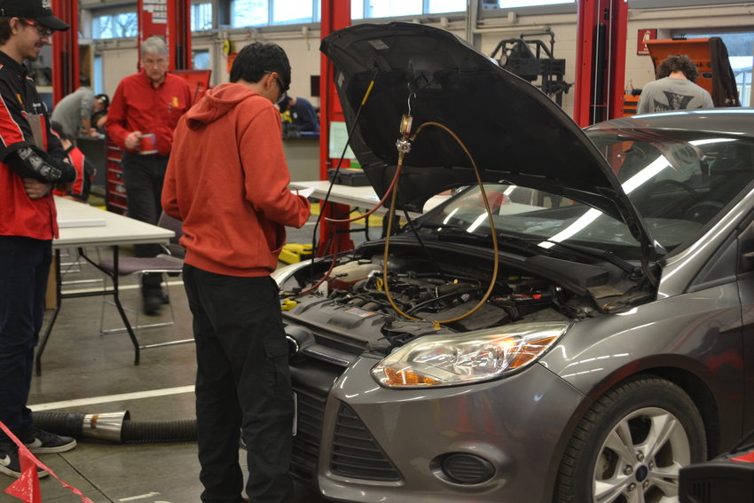 A student is judged on his ability to diagnosis a problem with this vehicle&rsquo;s heating and air conditioning during the skills competition at the Kansas Technology Center on the Pittsburg State campus.