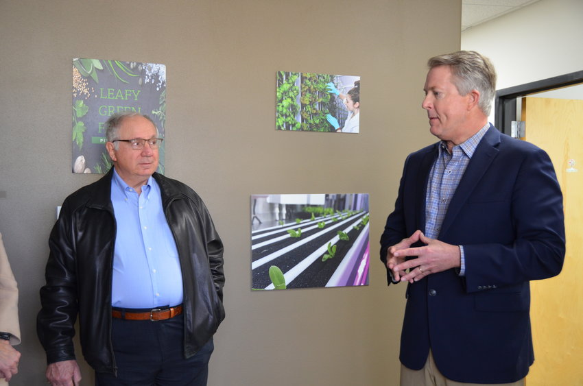Sen. Roger Marshall, right, tells Leafy Green Farms staff and Mayor Ronald Seglie that he is excited to see the hydroponic farms being placed at schools across the state.