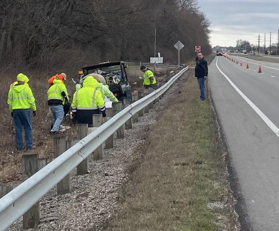 Commissioner Tom Moody, in black, directing road crews during a trash sweep along US-69 north of Frontenac.&nbsp;