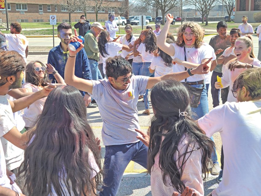 Students and community members celebrated Holi hosted by the Indian Student Association at Pittsburg State University on Saturday. Attendees danced and tossed brightly colored powders into the air and at each other.