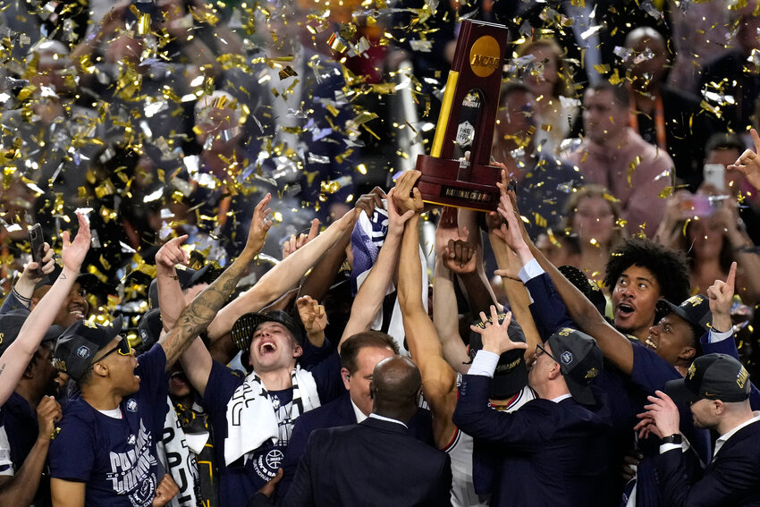 Connecticut players celebrate their win over San Diego State in the men's national championship game in the NCAA Tournament on Monday, April 3, 2023, in Houston. Connecticut won 76-59. (AP Photo/Godofredo A. Vasquez)