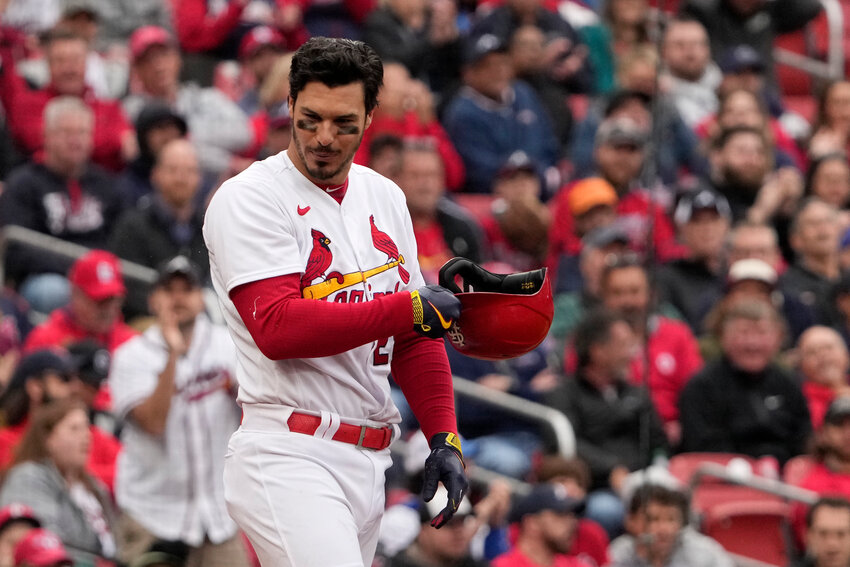 St. Louis Cardinals' Nolan Arenado removes his helmet after striking out to end the sixth inning of a baseball game against the Atlanta Braves Wednesday, April 5, 2023, in St. Louis. (AP Photo/Jeff Roberson)