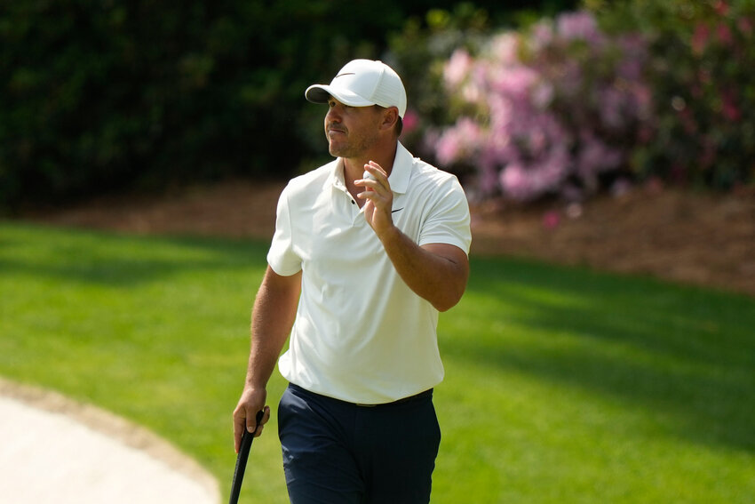 Brooks Koepka waves after his putt on the 13th hole during the second round of the Masters on Friday at Augusta National Golf Club in Augusta, Ga. (AP Photo/Charlie Riedel)