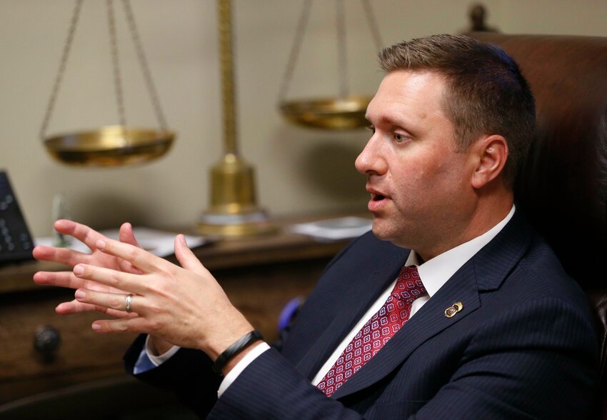 FILE - District 12 District Attorney Matt Ballard talks at the Rogers County Courthouse on May 4, 2016, in Claremore, Okla. An Oklahoma man convicted of murder for stabbing another man to death in 2018 could get a new trial after Ballard acknowledged in a court filing on March 17, 2023, that two of his former prosecutors watched jurors deliberate via a video feed into the courtroom. In Oklahoma, it is a felony to listen to or observe jurors deliberate in a case. (Matt Barnard/Tulsa World via AP, File)