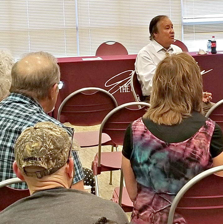 Billy Mills, a three-time All-American cross country runner at Kansas and the 1964 Olympic champion in the 10,000 meters, answers question during his visit to the Gordon Parks Museum on Wednesday in Fort Scott.
