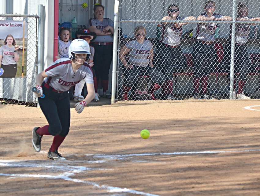 Northeast's Autumn Claffey lays down a bunt single against Liberal on Thursday in Arma. JEFF PEYTON / MORNING SUN STAFF