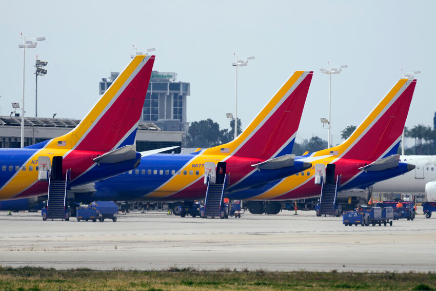 Southwest Airlines planes are parked at the terminal at Long Beach Airport, Tuesday, April 18, 2023, in Long Beach, Calif. Southwest Airlines planes were grounded nationwide for what the airline called an intermittent technology issue, causing more than 1,700 flight delays Tuesday just four months after the carrier suffered a meltdown over the Christmas travel rush.  The hold on departures was lifted by late morning, shortly after it was announced, according to Southwest and the Federal Aviation Administration, but not before traffic at airports from Denver to New York City backed up. (AP Photo/Ashley Landis)