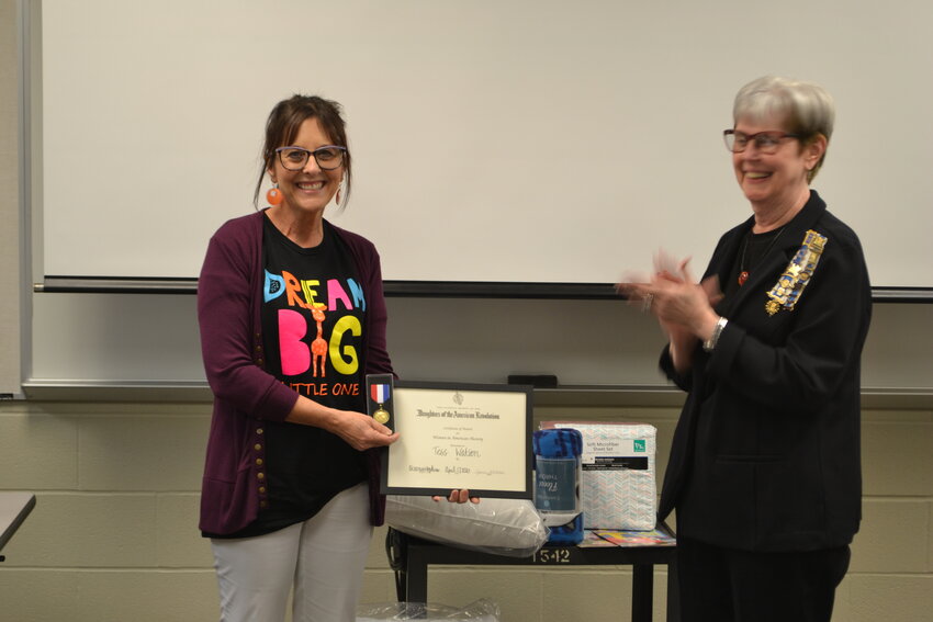 Tess Watson, founder of Dream Big Little One Association is presented with the Women in American History Medal with certificate by Mary Gilpin of the Oceanus Hopkins Chapter of the Daughters of the American Revolution.