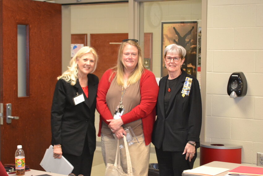 Tuesday evening, Krista Yockey Fisher, center, was inducted into the the Oceanus Hopkins Chapter of the Daughters of the American Revolution by chaplain Mary Jo Meier, left, and historian Mary Gilpin, right. To become a member of the DAR, an applicant must prove lineal descent from anyone that fought for or assisted the Patriot cause during the American Revolution.