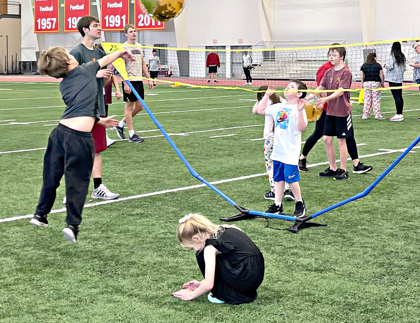 Youths and adults alike play volleyball during Wednesday's TR-Iffic Field Day at the Robert W. Plaster Center at Pittsburg State University.