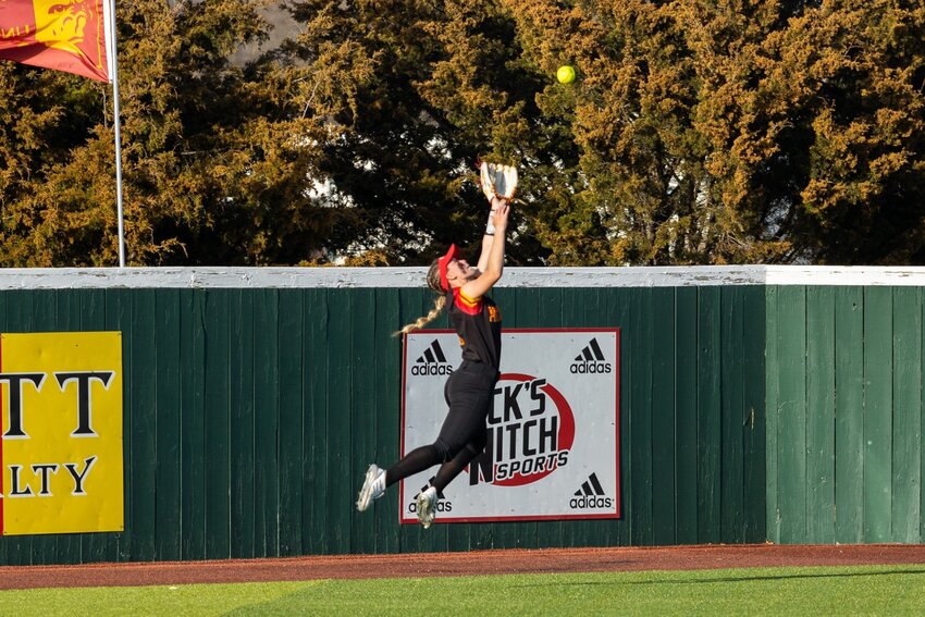 Pittsburg State's Heather Arnett makes a leaping catch in left field, one of her web gems this season. COURTESY DEREK LIVINGSTON / PSU SPORTS INFORMATION DEPARTMENT