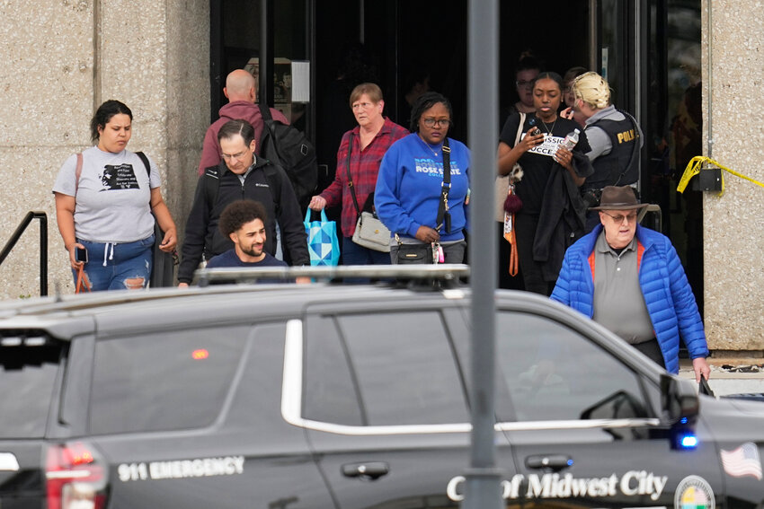 People are evacuated from a building following a shooting at Rose State College, Monday, April 24, 2023, in Midwest City, Okla. Police say one person was shot and killed and that a suspect is in custody after school officials told students to shelter in place. (AP Photo/Sue Ogrocki)