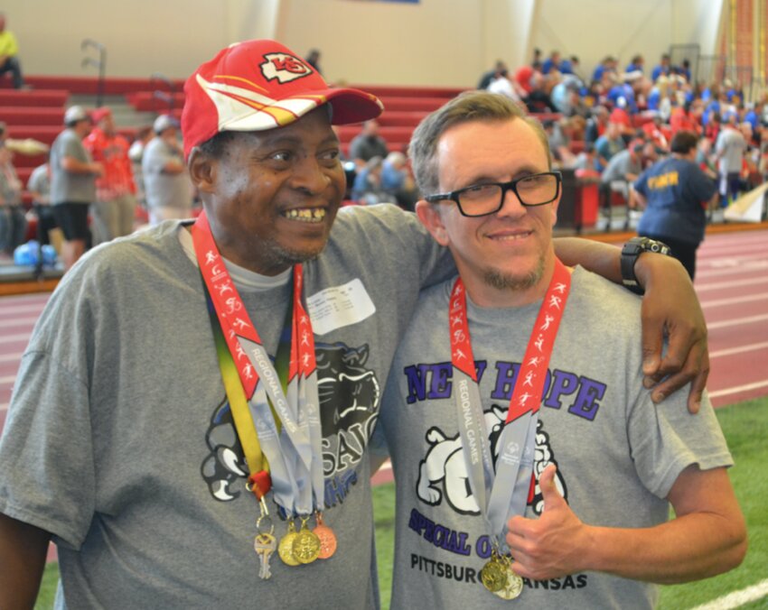 Donnie Luton and Chevi Peters, both employees of Pittsburg Parks and Recreation, show off their medals during the SEK Special Olympics Track and Field Day at the PSU Plaster Center. Both athletes were cheered on and supported by their co-workers from Parks and Rec throughout the day.