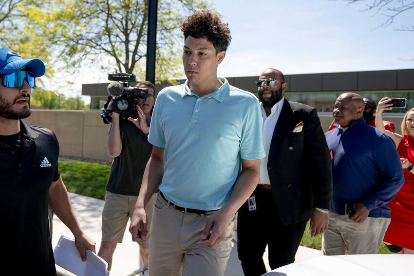 Jackson Mahomes, center, exits the Johnson County jail after being arraigned on three charges of sexual battery on Wednesday, May 3, 2023, in Olathe, Kan. (Nick Wagner/The Kansas City Star via AP)