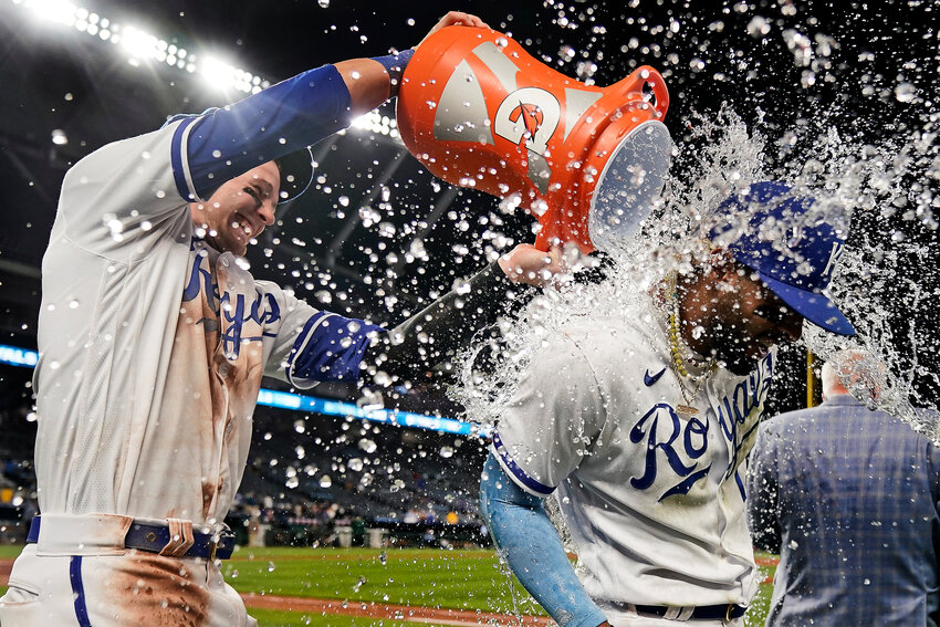 Kansas City Royals' MJ Melendez, right, is doused by Bobby Witt Jr. after their baseball game against the Chicago White Sox Monday, May 8, 2023, in Kansas City, Mo.