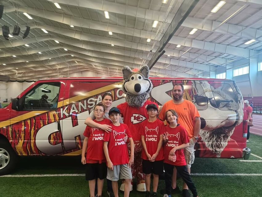 A local family show their KC Wolf shirts at the Pitt State Plaster Center on Sunday. Pastor Donnie Talent said KC Wolf Day was &ldquo;a great community event that brought smile to kids and adults alike.&quot;