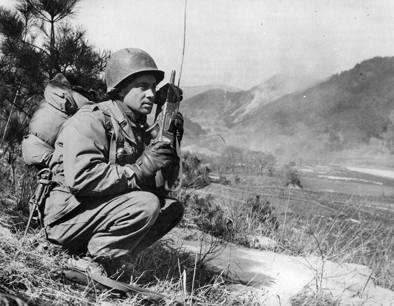 1st Lieutenant John Mellon, an Army forward observer calls in an artillery strike in Korea, 1951. Observers are the eyes of the mortars and artillery crews. They locate targets and relay the coordinates back to a fire direction center that converts the location into a firing solution for the gunners.