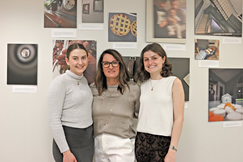 Elizabeth Spencer (center) with student research assistants Ashley Fisher (left) and Kennedi Beam (right) at the Alzheimer's and Dementia Photo Voice Showcase opening reception, hosted by the College of Communication and Information at the University of Kentucky.