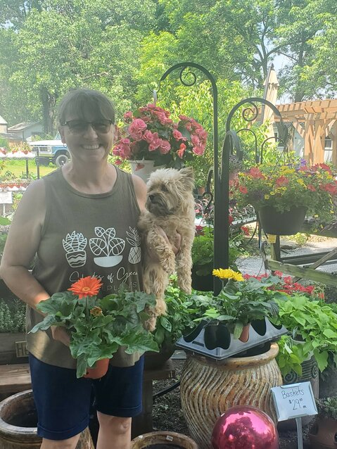 Carla Thompson, husband Ed, and many family members and friends help run the family owned and operated seasonal garden. Carla stated that she can't run her business without their help. Her dog, Bentley, always brings a smile to her patrons.&nbsp;