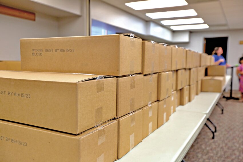 The Girard Public Library handed out 178 boxes each bundled with 10 milks, five lunch packs and five breakfast packs on Wednesday, kicking off the first day of the summer food program.