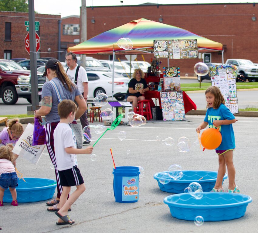 Attendees enjoyed the activities provided at the Pittsburg Public Library&rsquo;s Community Block Party on Thursday as several kids waved their bubble wands around at the bubble station.