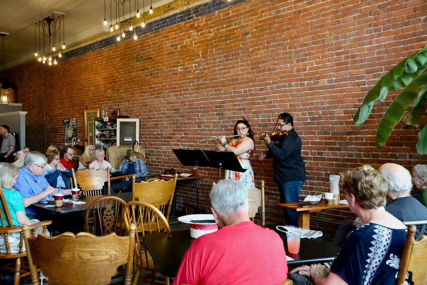 Duo Capriccioso, comprised of Pittsburg State University adjunct music faculty Denissa Munguia and Director of Orchestras Raul Munguia performed &ldquo;Brewtiful Tunes&rdquo; at Signet Coffee Roasters on Wednesday to open the fourth day of the Pittsburg Festival of the Arts. The duo performed a variety of American, classical, and Latin American melodies on the flute and violin.