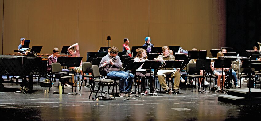 High school musicians, and several middle school musicians, practice their instruments following lunch break during the one-day Summer Youth Band Camp at the Bicknell Family Center for the Arts.