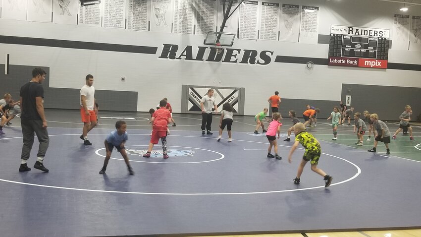 Almost 130 boys and girls attended the Black Diamond Wrestling Camp this week at Frontenac High School. JIM HENRY / MORNING SUN STAFF