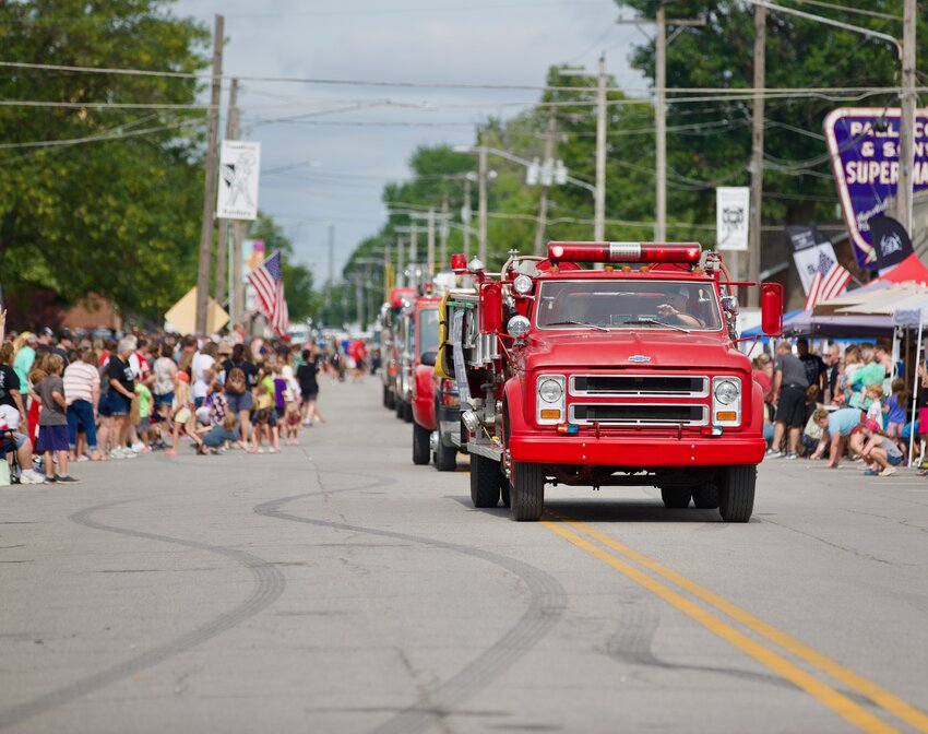 The Frontenac Fire Department, along with several additional county departments, make their way down McCay Street during the Frontenac Mining Days parade as hundreds of area residents lined along the street to witness the annual tradition.